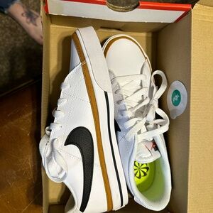 Nike White and Black Sneakers with Clean Design and Large Swoosh